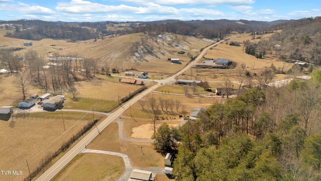 birds eye view of property featuring a mountain view and a rural view