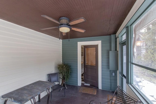 sunroom / solarium featuring wooden ceiling and ceiling fan