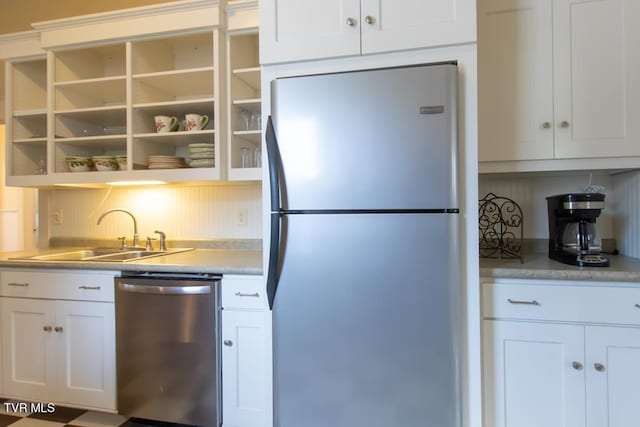 kitchen featuring white cabinetry, appliances with stainless steel finishes, and sink