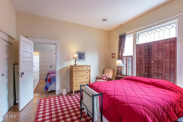 bedroom with wood-type flooring