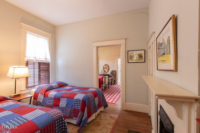 bedroom with hardwood / wood-style flooring