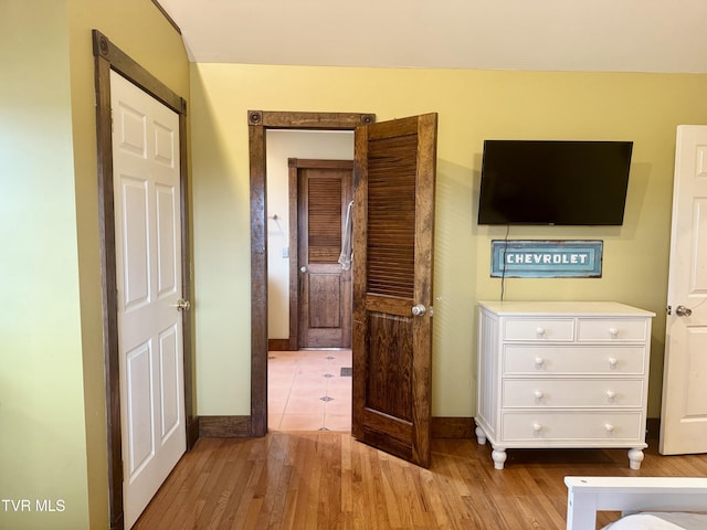 unfurnished bedroom with light wood-type flooring