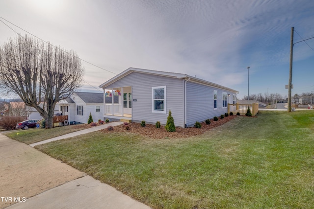 view of front of home featuring a front lawn and a porch