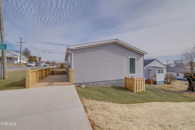 view of home's exterior with a lawn