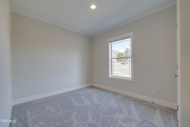 carpeted empty room with ornamental molding