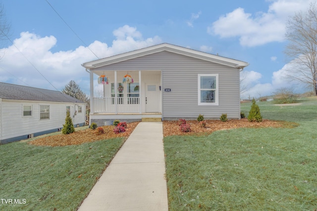 view of front facade with covered porch and a front lawn