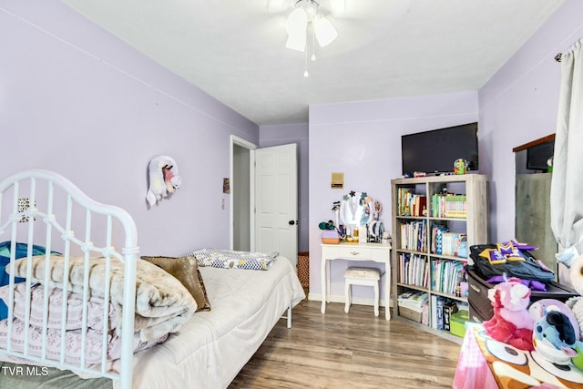 bedroom featuring hardwood / wood-style flooring and ceiling fan