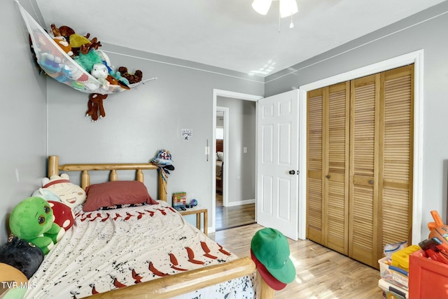 bedroom featuring light wood-type flooring and a closet