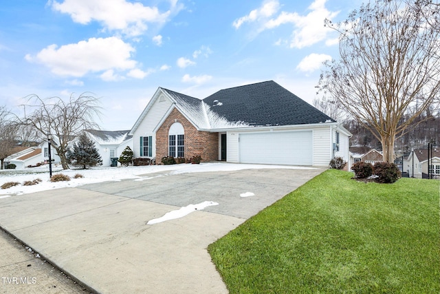 view of front of home with a garage and a front yard