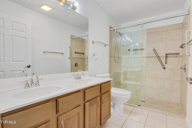 bathroom with an enclosed shower, vanity, tile patterned floors, and toilet