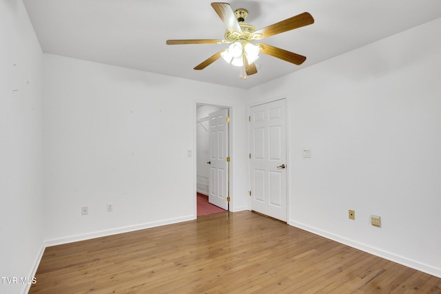 unfurnished room featuring hardwood / wood-style flooring and ceiling fan