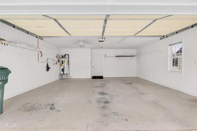 garage featuring a garage door opener and electric water heater