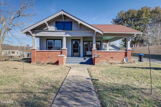 bungalow-style house featuring a front yard and a porch