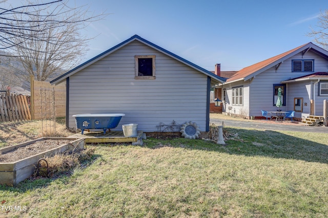 back of house with a yard