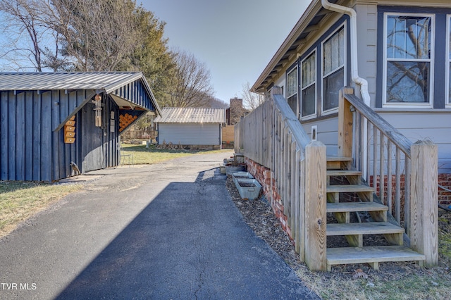 view of home's exterior featuring a storage shed