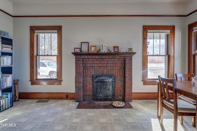 living room featuring a fireplace and carpet