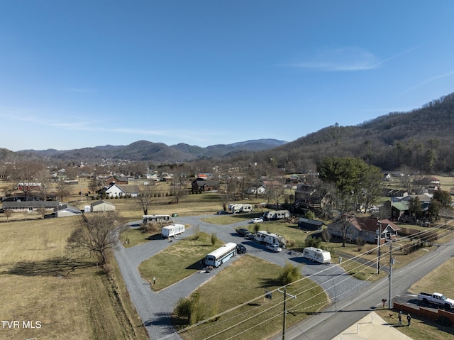 drone / aerial view featuring a mountain view