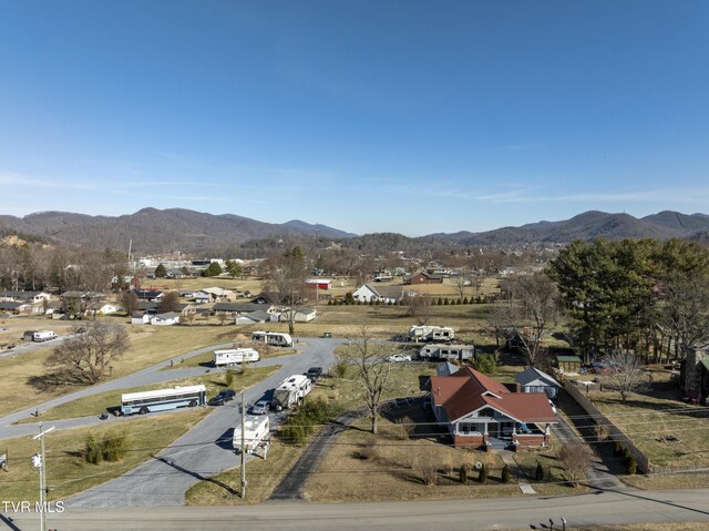 birds eye view of property featuring a mountain view