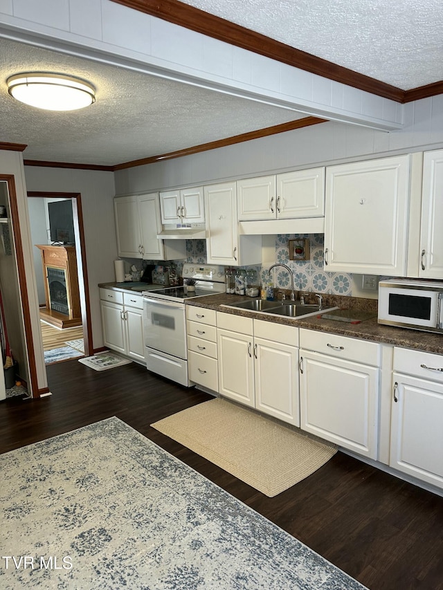 kitchen with crown molding, sink, white appliances, and white cabinets