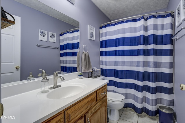 bathroom with vanity, walk in shower, toilet, tile patterned floors, and a textured ceiling