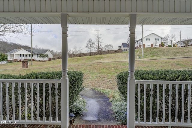 view of yard with covered porch