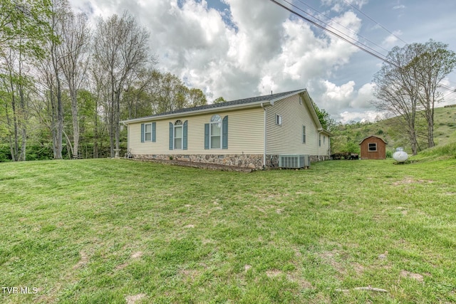 112 Conns Dr, Tazewell, VA 24651 - view of property exterior with a lawn, a storage unit, an outdoor structure, and cooling unit