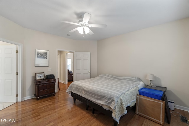 bedroom featuring light hardwood / wood-style floors and ceiling fan