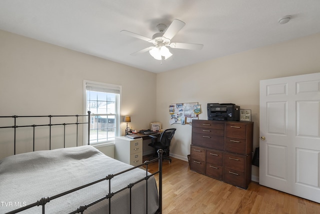 bedroom with light hardwood / wood-style floors and ceiling fan