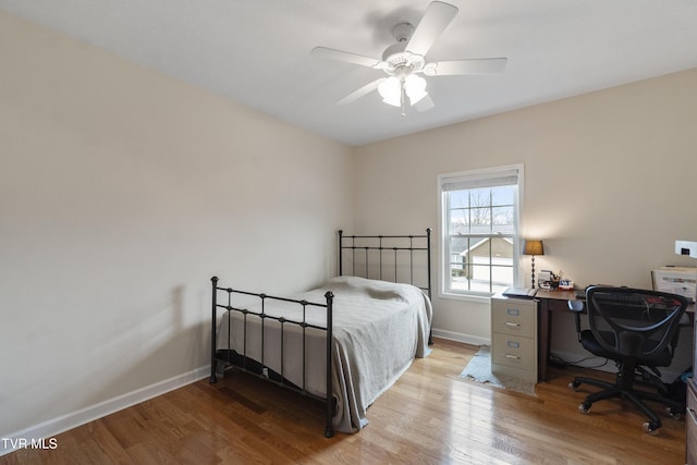 bedroom with light hardwood / wood-style floors and ceiling fan