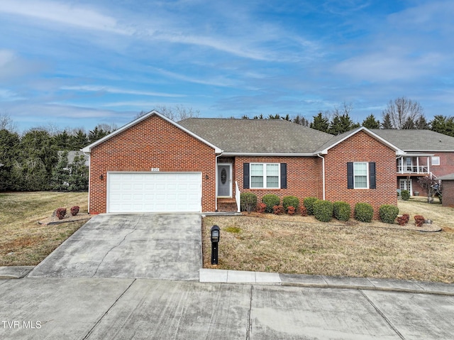 ranch-style home featuring a garage and a front lawn