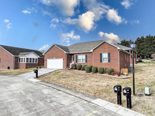 ranch-style house featuring a garage, central AC unit, and a front lawn