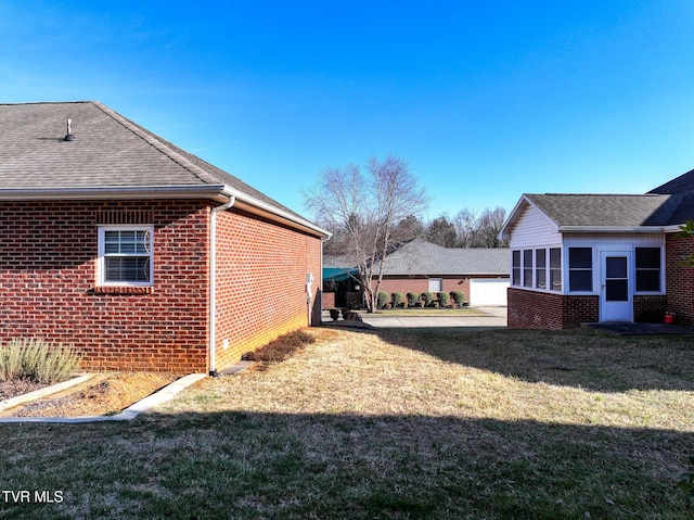 view of side of property featuring a yard