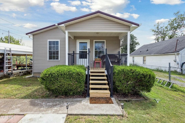 bungalow featuring a front lawn and covered porch