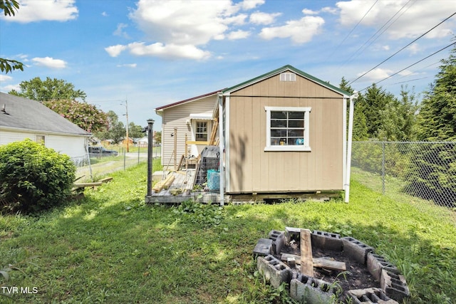 view of outdoor structure featuring a yard