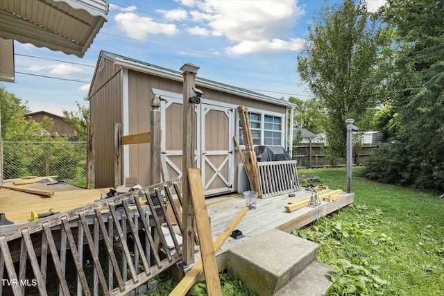 view of outbuilding with a yard