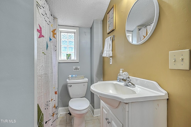 bathroom with vanity, toilet, tile patterned floors, a textured ceiling, and a shower with curtain