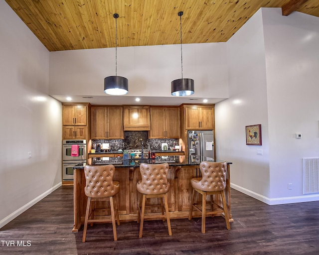 kitchen with wood ceiling, dark hardwood / wood-style flooring, pendant lighting, stainless steel appliances, and backsplash