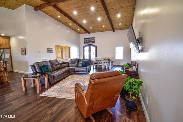 living room with beam ceiling, dark hardwood / wood-style flooring, wooden ceiling, and high vaulted ceiling