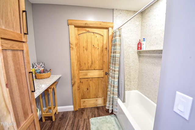 bathroom featuring hardwood / wood-style floors and shower / bath combo