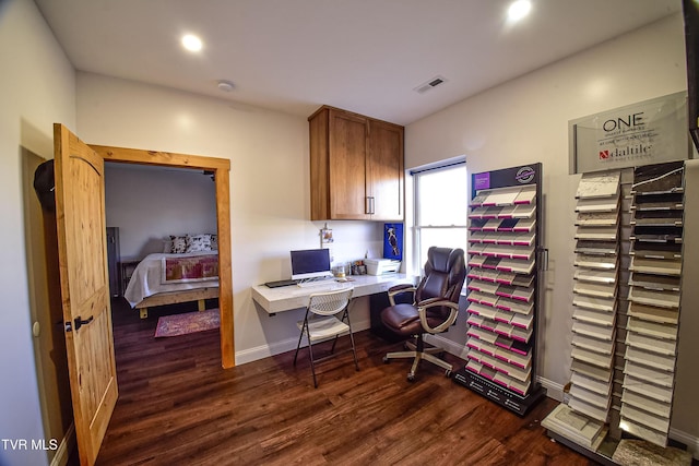 home office with dark wood-type flooring