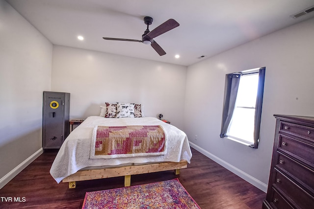 bedroom featuring ceiling fan and dark hardwood / wood-style floors