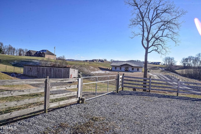 view of yard with a rural view