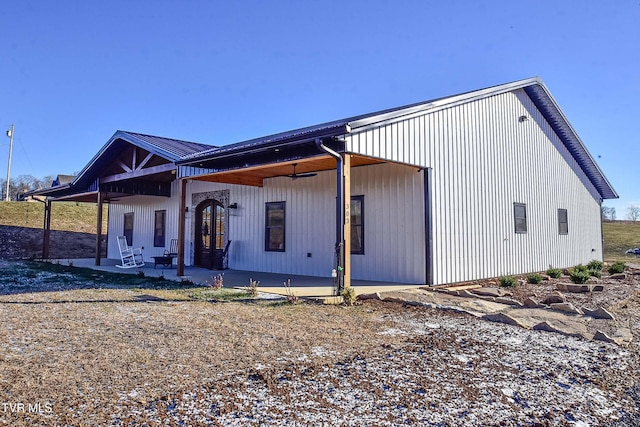 view of side of property featuring a patio