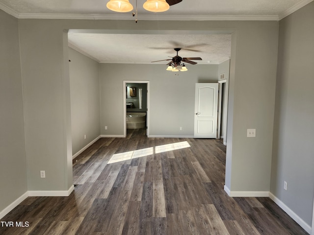 unfurnished room with ornamental molding, dark wood-type flooring, a textured ceiling, and ceiling fan