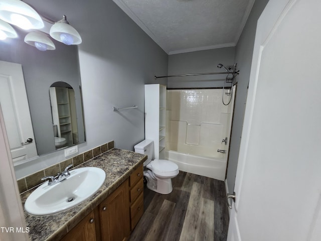 full bathroom with crown molding, a textured ceiling, shower / washtub combination, vanity, and hardwood / wood-style flooring