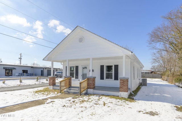 bungalow-style home featuring central AC and a porch