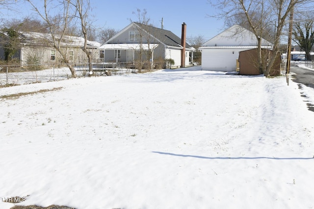 view of yard layered in snow