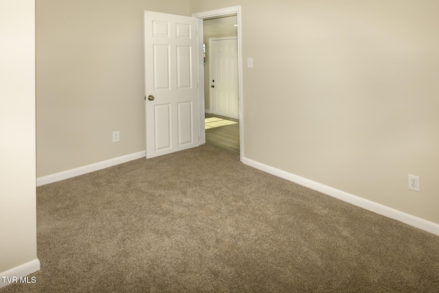 empty room featuring carpet floors