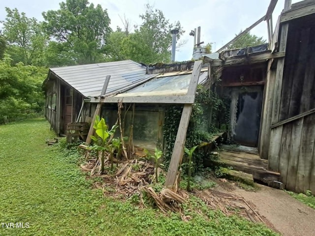 169 Church Cir, Bristol, TN 37620 - rear view of house with metal roof and a lawn