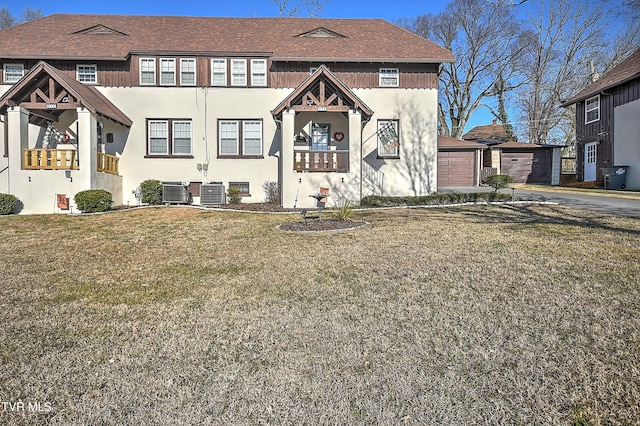 view of front of house featuring a front lawn and central air condition unit